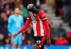 Southampton's Moussa Djenepo appears dejected after being shown a red card by referee Graham Scott after consulting theVAR screen during the English Premier League soccer match between Southampton and Newcastle United, at St Mary's Stadium, Southampton, England, Saturday March 7, 2020. (Mark Kerton/PA via AP)