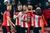 Southampton's Danny Ings, centre, celebrates with teammates after scoring his side's first goal during the English Premier League soccer match between Southampton and Tottenham Hotspur at St Mary's Stadium, in Southampton, England, Wednesday Jan. 1, 2020. (Mark Kerton/PA via AP)