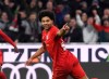 Bayern's Serge Gnabry reacts after scoring, during the Germany Bundesliga soccer match between Bayern Munich and VfL Wolfsburg at the Allianz Arena in Munich, Germany, Saturday, Dec. 21, 2019. (Angelika Warmuth/dpa via AP)
