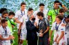 Real Madrid's team players with Real Madrid president Florentino Perez, centre left and Real Madrid's head coach Raul Gonzalez Blanco,celebrate with the trophy after winning the UEFA Youth League final soccer match between SL Benfica from Portugal and Real Madrid CF from Spain at the Colovray Sports Centre stadium in Nyon, Switzerland, Tuesday, Aug. 25, 2020. (Jean-Christophe Bott/Keystone via AP)