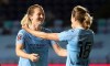 Manchester City's Sam Mewis, left, celebrates with teammmate Ellen White, after scoring her team's second goal, during the Women's FA Cup semi final soccer match between Manchester City and Arsenal, at the Academy Stadium, in Manchester, England, Thursday, Oct. 1, 2020. (Martin Rickett/PA via AP)