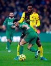 Wolverhampton Wanderers' Pedro Neto, foreground and Watford's Nathaniel Chalobah battle for the ball , during the English Premier League soccer match between Watford and Wolverhampton Wanderers at Vicarage Road, in Watford, England, Wednesday, Jan. 1, 2020. (Adam Davy/PA via AP)