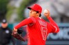 Los Angeles Angels designated hitter Shohei Ohtani throws to the plate during the first inning of a baseball game against the Texas Rangers Tuesday, April 20, 2021, in Anaheim, Calif. (AP Photo/Mark J. Terrill)