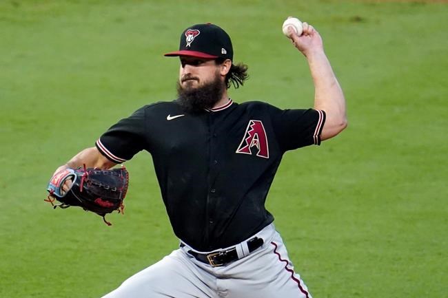 Arizona Diamondbacks starting pitcher Caleb Smith throws to the Los Angeles Angels during the first inning of a baseball game Wednesday, Sept. 16, 2020, in Anaheim, Calif. (AP Photo/Marcio Jose Sanchez)