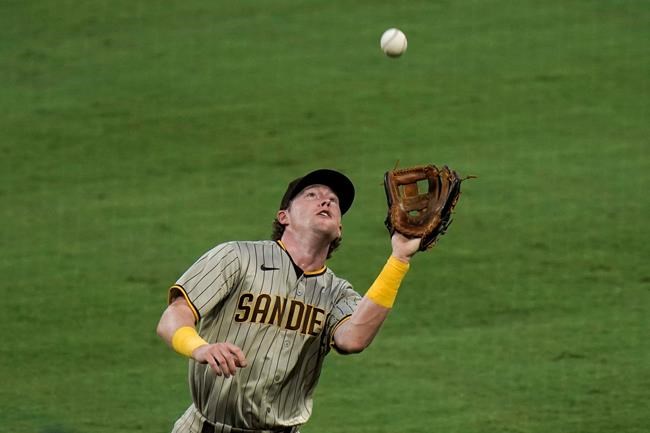San Diego Padres second baseman Jake Cronenworth catches a fly ball hit by Los Angeles Angels' Jo Adell during the second inning of a baseball game, Wednesday, Sept. 2, 2020, in Anaheim, Calif. (AP Photo/Jae C. Hong)