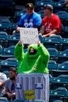 ADDS FULL NAME OF COSTUME - A fan wears an Oscar the Grouch costume as he taunts the Houston Astros prior to a baseball game against the Los Angeles Angels Tuesday, April 6, 2021, in Anaheim, Calif. (AP Photo/Mark J. Terrill)