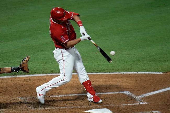 Los Angeles Angels' Mike Trout hits a two-run home run during the third inning of a baseball game against the San Diego Padres, Wednesday, Sept. 2, 2020, in Anaheim, Calif. (AP Photo/Jae C. Hong)
