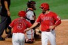 Los Angeles Angels' Anthony Rendon, right, celebrates with Tommy La Stella after both scored on a double by Albert Pujols during the fifth inning of the team's baseball game against the San Francisco Giants in Anaheim, Calif., Monday, Aug. 17, 2020. (AP Photo/Kelvin Kuo)