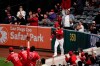 Fans cheer after Los Angeles Angels' Taylor Ward caught a fly ball hit by Tampa Bay Rays' Yandy Diaz during the sixth inning of a baseball game Thursday, May 6, 2021, in Anaheim, Calif. (AP Photo/Jae C. Hong)