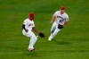 Los Angeles Angels' Mike Trout, right, watches as Justin Upton makes a fielding error while trying to catch a ball hit by Oakland Athletics' Mark Canha during the fourth inning of a baseball game, Monday, Aug. 10, 2020, in Anaheim, Calif. (AP Photo/Jae C. Hong)
