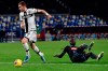 Parma's Dejan Kulusevski, left, controls the ball on his way to score during the Italian Serie A soccer match between Napoli and Parma at the San Paolo stadium in Naples, Italy, Saturday, Dec. 14, 2019. (Ciro Fusco/ANSA via AP)
