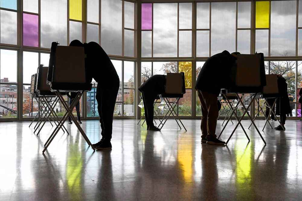 Voters mark their ballots at First Presbyterian Church on Election Day, Tuesday, Nov. 3, 2020, in Stamford, Conn. (Jessica Hill / The Associated Press)