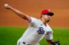 Texas Rangers starting pitcher Dane Dunning throws to a Toronto Blue Jays batter during the first inning of a baseball game in Arlington, Texas, Tuesday, April 6, 2021. (AP Photo/Tony Gutierrez)