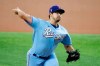 Texas Rangers starting pitcher Dane Dunning throws against the Seattle Mariners during the first inning of a baseball game Sunday, May 9, 2021, in Arlington, Texas. (AP Photo/Michael Ainsworth)