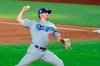 Los Angeles Dodgers starting pitcher Ross Stripling works against the Texas Rangers during the first inning of a baseball game Saturday, Aug. 29, 2020, in Arlington, Texas. (AP Photo/Jeffrey McWhorter)