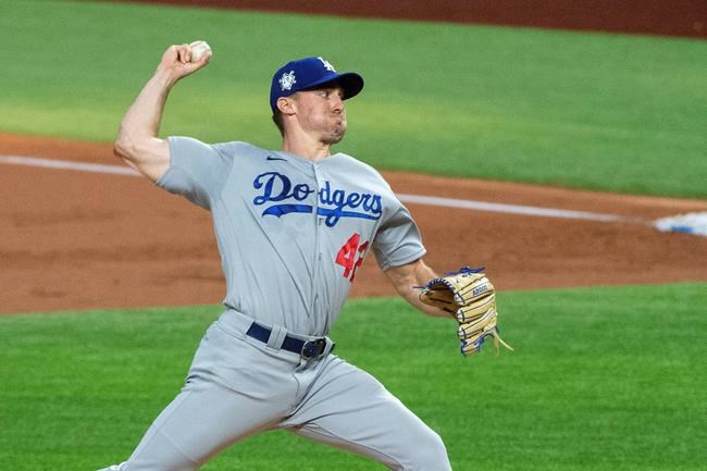 Los Angeles Dodgers starting pitcher Ross Stripling works against the Texas Rangers during the first inning of a baseball game Saturday, Aug. 29, 2020, in Arlington, Texas. (AP Photo/Jeffrey McWhorter)