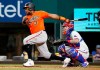 Baltimore Orioles' Maikel Franco follows thru on a base hit against the Texas Rangers during the fifth inning of a baseball game in Arlington, Texas, Saturday, April 17, 2021. (AP Photo/Ray Carlin)