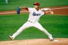 Texas Rangers starting pitcher Mike Minor delivers to the plate against the Seattle Mariners in the first inning of a baseball game in Arlington, Texas, Tuesday, Aug. 11, 2020. (AP Photo/Ray Carlin)