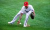 Texas Rangers relief pitcher Matt Bush (51) fields a hit by Toronto Blue Jays' Bo Bichette (11) during the eighth inning of a baseball game, Wednesday, April 7, 2021, in Arlington, Texas. Bush was unable to make the throw to first. (AP Photo/Brandon Wade)