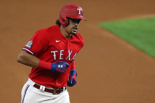 Texas Rangers Ronald Guzman (11) rounds third base after a two-run home run against the Oakland Athletics in the first inning in a baseball game Saturday, Sept. 12, 2020 in Arlington, Texas. (AP Photo/Richard W. Rodriguez)
