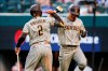 San Diego Padres' Ha-Seong Kim, right, is congratulated by Trent Grisham (2) after hitting a solo home run during the fifth inning of a baseball game against the Texas Rangers, Saturday, April 10, 2021, in Arlington, Texas. (AP Photo/Brandon Wade)