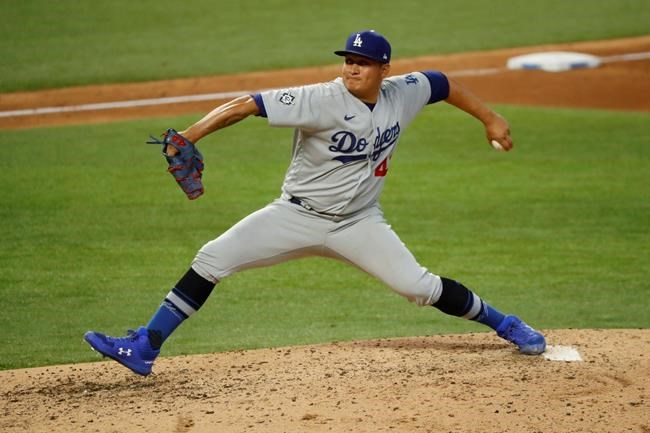 Los Angeles Dodgers relief pitcher Victor Gonzalez throws a pitch during the fifth inning of a baseball game against the Texas Rangers in Arlington, Texas, Sunday, Aug. 30, 2020. (AP Photo/Roger Steinman)