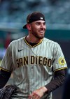 San Diego Padres starting pitcher Joe Musgrove smiles while looking to fans in the stands after pitching a no-hitter against the Texas Rangers in a baseball game Friday, April 9, 2021, in Arlington, Texas. (AP Photo/Richard W. Rodriguez)