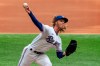 Texas Rangers starting pitcher Mike Foltynewicz works against the Toronto Blue Jays during the first inning of a baseball game Monday, April 5, 2021, in Arlington, Texas. (AP Photo/Jeffrey McWhorter)