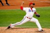 Texas Rangers relief pitcher Edinson Volquez throws to a Seattle Mariners batter during the fifth inning of a baseball game in Arlington, Texas, Tuesday, Aug. 11, 2020. (AP Photo/Ray Carlin)