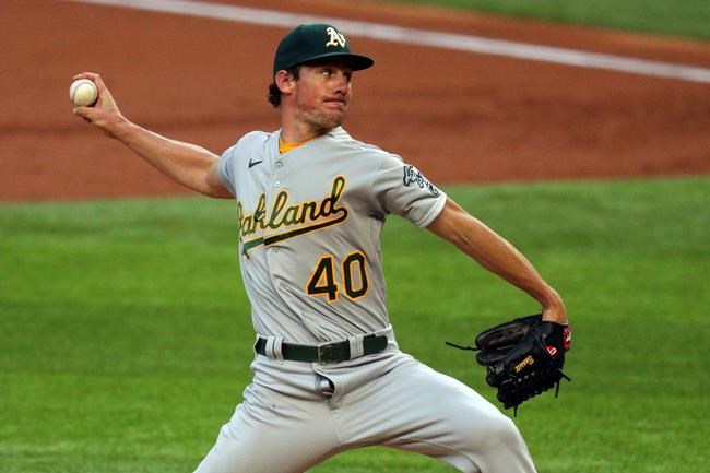 Oakland Athletics starting pitcher Chris Bassitt works the first inning in the second baseball game of a doubleheader against the Texas Rangers on Saturday, Sept. 12, 2020, in Arlington, Texas. (AP Photo/Richard W. Rodriguez)