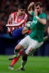 Atletico Madrid's Alvaro Morata kicks the ball past Lokomotiv's Solomon Kvirkvelia during the Champions League Group D soccer match between Atletico Madrid and Lokomotiv Moscow at Wanda Metropolitano stadium in Madrid, Spain, Wednesday, Dec. 11, 2019. (AP Photo/Manu Fernandez)