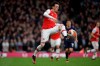Arsenal's Mesut Ozil controls the ball during the Premier League soccer match between Arsenal and West Ham at the Emirates Stadium in London, Saturday, March 7, 2020.(AP Photo/Matt Dunham)
