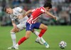 Atletico Madrid's Joao Felix vies for the ball Real Madrid's Toni Kroos during the Spanish Super Cup Final soccer match between Real Madrid and Atletico Madrid at King Abdullah stadium in Jiddah, Saudi Arabia, Sunday, Jan. 12, 2020. (AP Photo/Hassan Ammar)