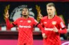Leverkusen's Leon Bailey, left, celebrates after scoring his side goal during the German Bundesliga soccer match between Bayer Leverkusen and Borussia Dortmund in Leverkusen, Germany, Saturday, Feb. 8, 2020. (AP Photo/Martin Meissner)