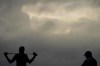 Justin Thomas and his caddie wait to tee off on the second hole during a practice round for the Masters golf tournament Tuesday, Nov. 10, 2020, in Augusta, Ga. (AP Photo/Charlie Riedel)