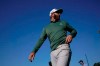 Dustin Johnson walks to the range during practice for the Masters golf tournament on Monday, April 5, 2021, in Augusta, Ga. (AP Photo/David J. Phillip)