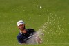 Dustin Johnson watches his bunker shot on the second hole during the second round of the Masters golf tournament Friday, Nov. 13, 2020, in Augusta, Ga. (AP Photo/Charlie Riedel)