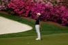 Is Woo Kim, of South Korea, reacts after missing an eagle putt on the 13th green during the second round of the Masters golf tournament on Friday, April 9, 2021, in Augusta, Ga. (AP Photo/David J. Phillip)
