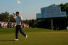 Hideki Matsuyama, of Japan, waves his cap after winning the Masters golf tournament on Sunday, April 11, 2021, in Augusta, Ga. (AP Photo/David J. Phillip)