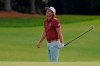Cameron Smith, of Australia, watches his chip to the 18th green during the final round of the Masters golf tournament Sunday, Nov. 15, 2020, in Augusta, Ga. (AP Photo/Charlie Riedel)