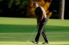 Tiger Woods watches his ball as he misses a birdie putt on the eighth hole during the first round of the Masters golf tournament Thursday, Nov. 12, 2020, in Augusta, Ga. (AP Photo/Charlie Riedel)