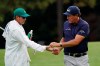 Phil Mickelson gets a ball from his caddie Tim Mickelson on the ninth hole during the first round of the Masters golf tournament Thursday, Nov. 12, 2020, in Augusta, Ga. (AP Photo/Charlie Riedel)