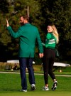 Masters golf champion Dustin Johnson walks with Pauline Gretzky after his victory Sunday, Nov. 15, 2020, in Augusta, Ga. (AP Photo/Chris Carlson)