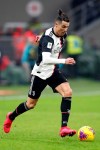 Juventus' Cristiano Ronaldo runs with the ball during an Italian Cup soccer match between AC Milan and Juventus at the San Siro stadium, in Milan, Italy, Thursday, Feb. 13, 2020. (AP Photo/Antonio Calanni)