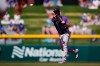 Colorado Rockies second baseman Chris Owings (12) throws to first to out Chicago Cubs' Joc Pederson during the first inning of a spring training baseball game Saturday, March 20, 2021, in Mesa, Ariz. (AP Photo/Ashley Landis)