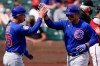 Chicago Cubs' Anthony Rizzo, right, high-fives Miguel Amaya (75) after they both score on a home run by Rizzon in the third inning of a spring training baseball game against the Arizona Diamondbacks Sunday, March 7, 2021, in Scottsdale, Ariz. (AP Photo/Ashley Landis)