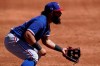 Texas Rangers second baseman Rougned Odor (12) stands at the ready during the third inning of a spring training baseball game against the Colorado Rockies Monday, March 22, 2021, in Scottsdale, Ariz. (AP Photo/Ashley Landis)