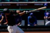 San Francisco Giants' Buster Posey breaks a bat while hitting for a double during the first inning of a spring training baseball game against the Chicago Cubs Wednesday, March 10, 2021, in Scottsdale, Ariz. (AP Photo/Ashley Landis)