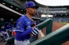 Los Angeles Dodgers right fielder Mookie Betts (50) leaves the dugout between innings of a spring training baseball game against the Chicago Cubs Thursday, March 25, 2021, in Mesa, Ariz. (AP Photo/Ashley Landis)