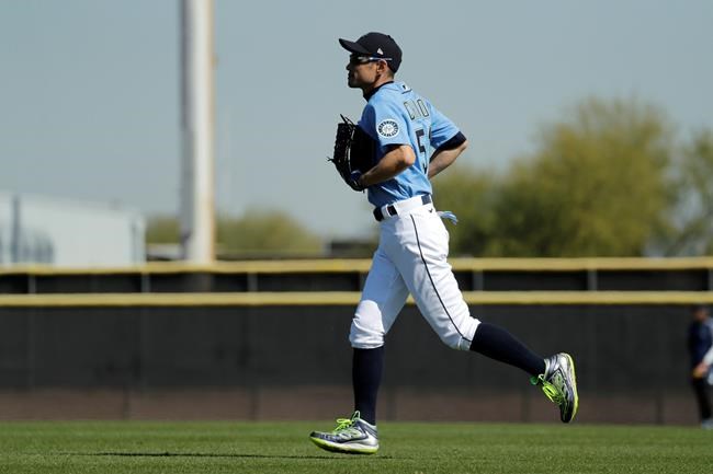 Seattle Mariners' Ichiro Suzuki fields balls during batting practice at spring baseball training Thursday, Feb. 13, 2020, in Peoria, Ariz. (AP Photo/Charlie Riedel)